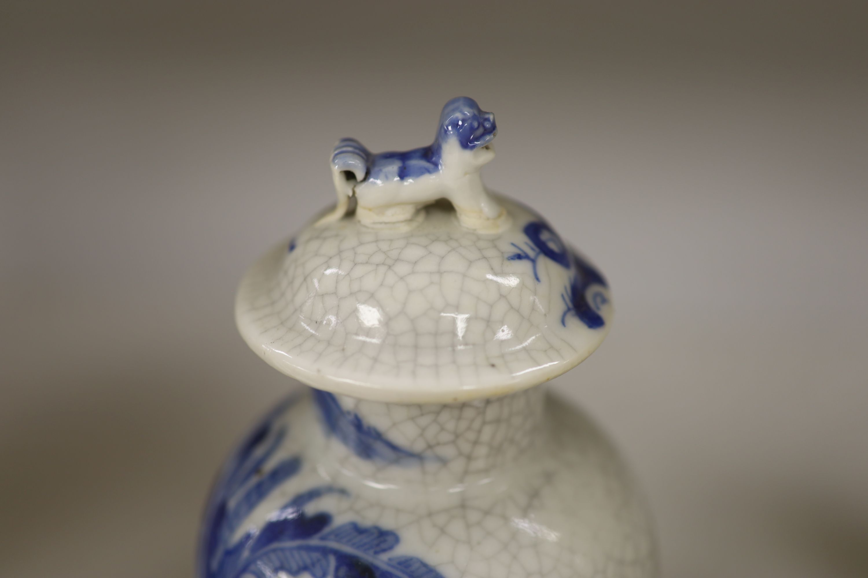 A late 19th century Chinese blue and white crackle glaze vase and cover, height 27cm